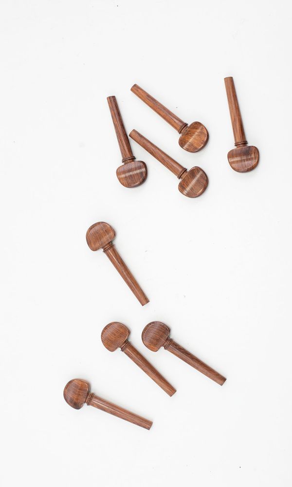 Eight cello pegs