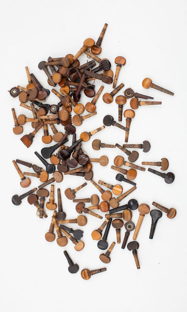 A collection of violin and viola pegs, varying sizes