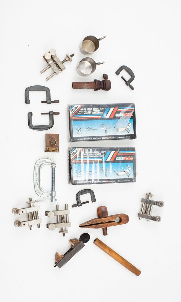 An assortment of clamps, varying sizes