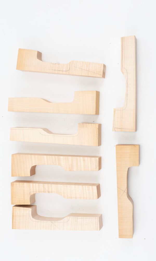Eight violin neck graft blanks, maple (partially made)