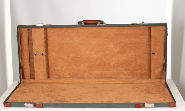 A twelve-slot bow case, branded Antonio