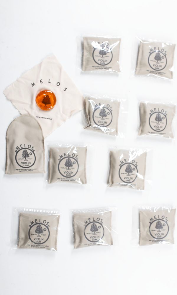 A bundle of ten violin rosins, branded Melos