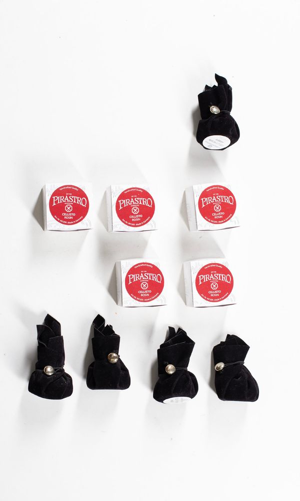 A bundle of ten cello rosins