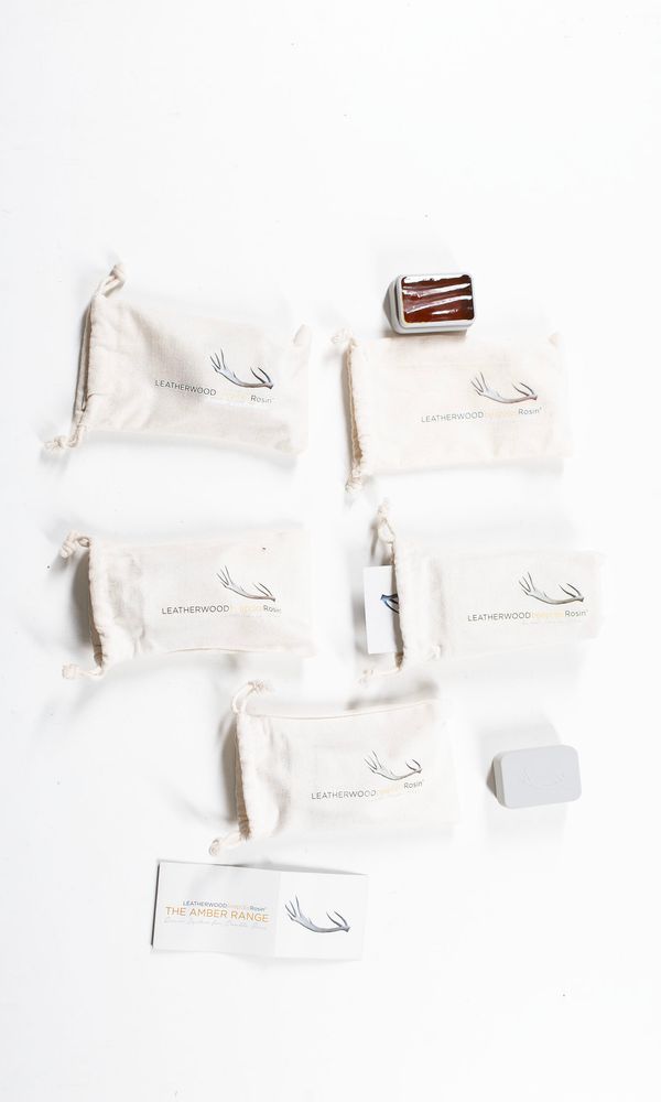 A bundle of five rosins, branded leatherwood