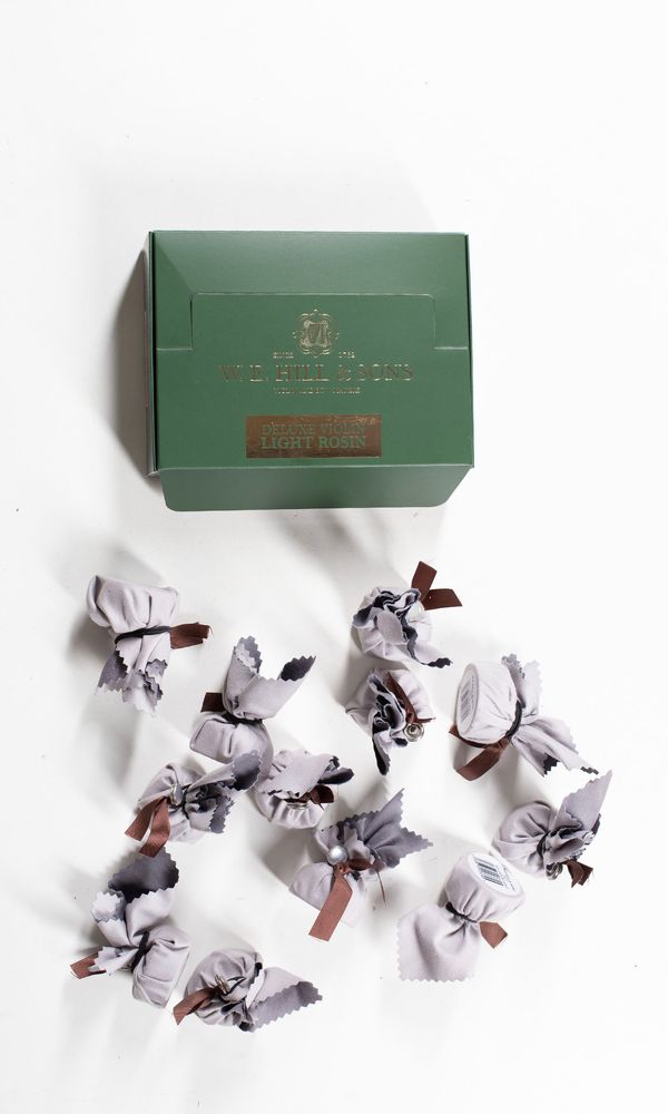 A box of twelve violin rosins, branded W. E. Hill & Sons