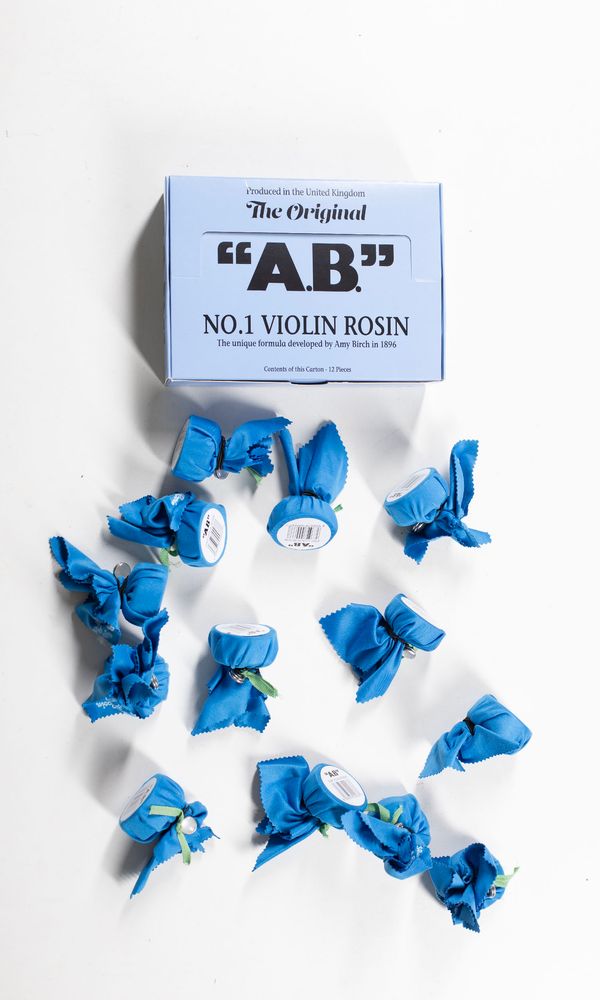 A box of thirteen violin rosins, branded A. B.