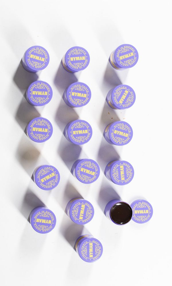 A bundle of sixteen bass rosins, branded Nyman