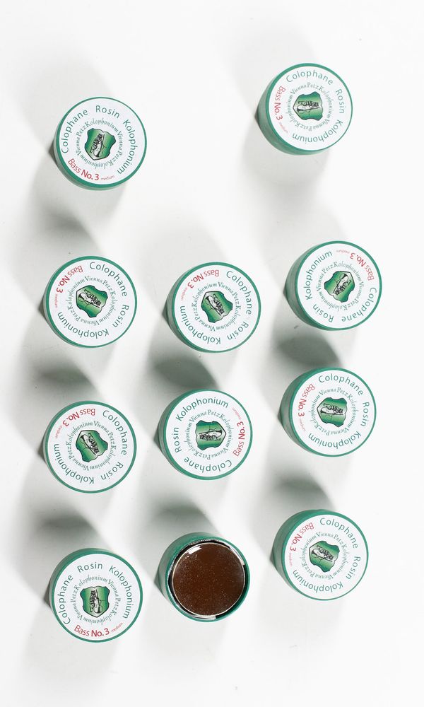 A bundle of eleven bass rosins, branded Kolophonium No 3