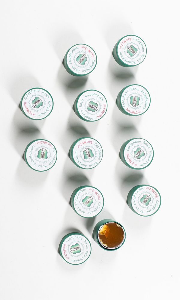 A bundle of eleven bass rosins, branded Kolophonium No 2