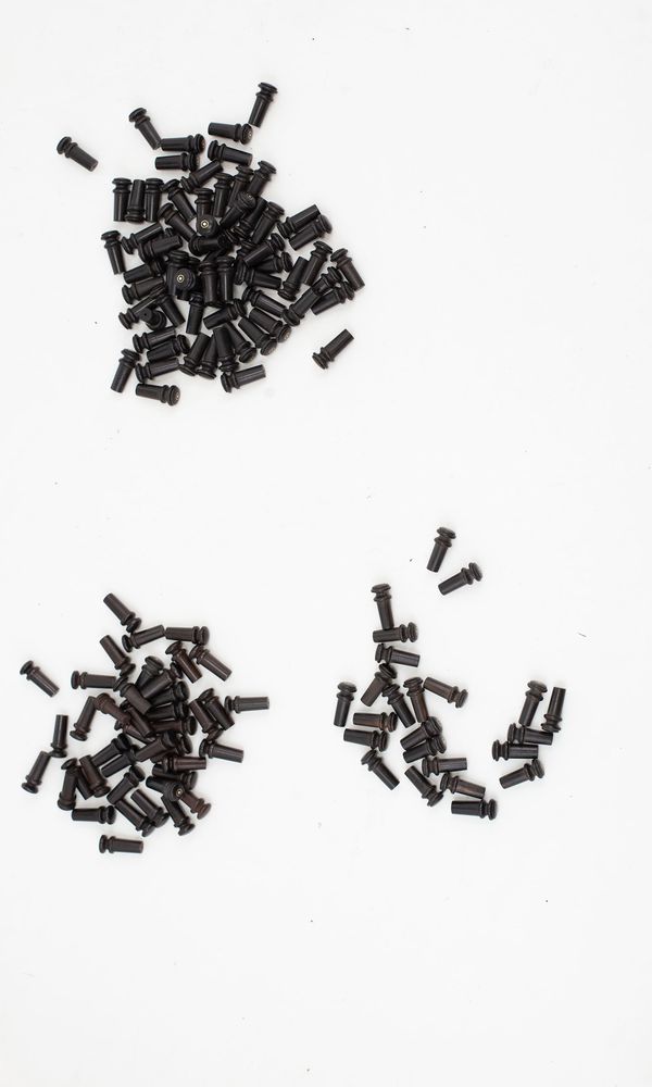 A box of viola Pirastro buttons and a small quantity of mixed buttons