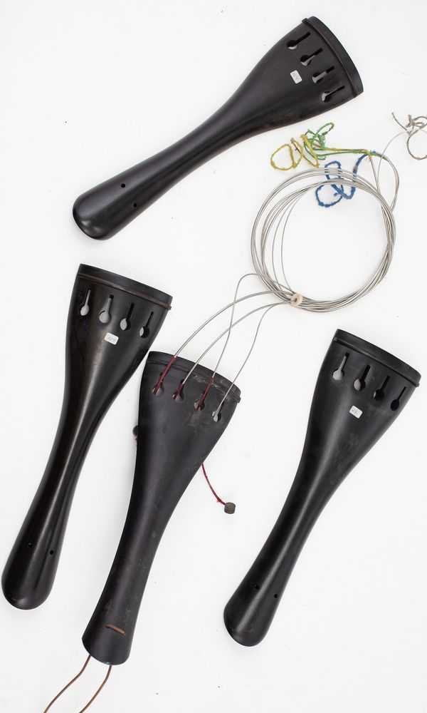 Four double bass tailpieces, one nut and four bridges