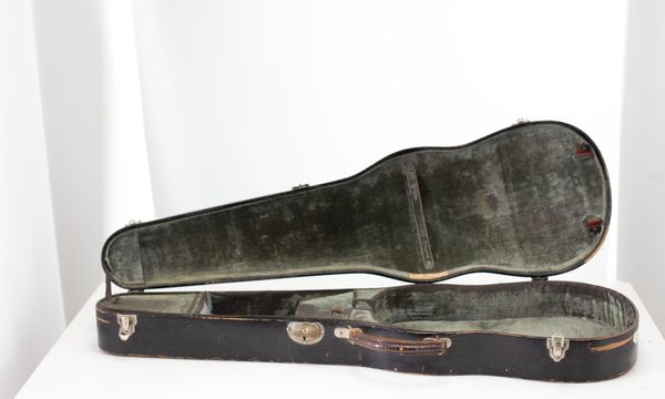 A violin case, branded W. E. Hill & Sons
