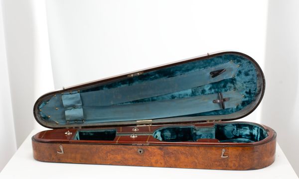 A violin case, branded Withers