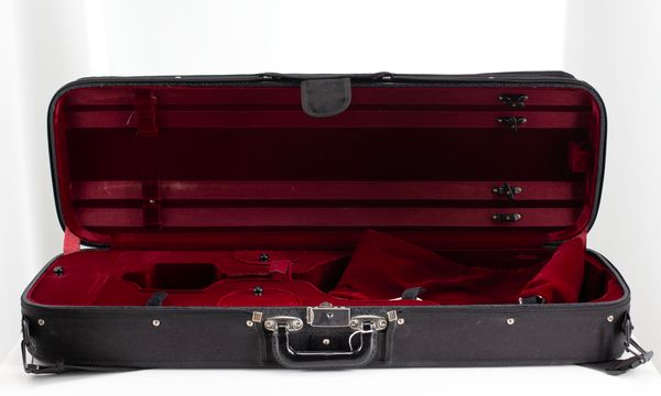 A bundle of three violin cases
