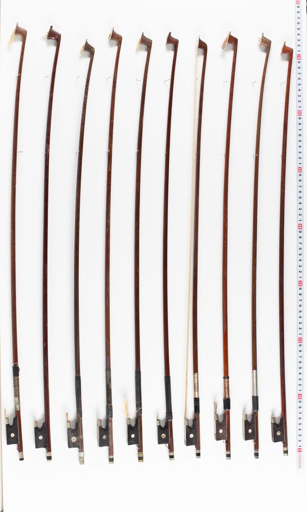 A bundle of sixteen violin bows, varying sizes
