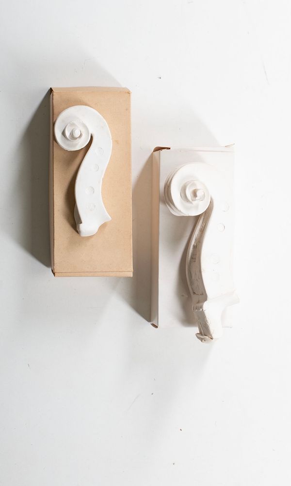 Three Amati family scroll casts