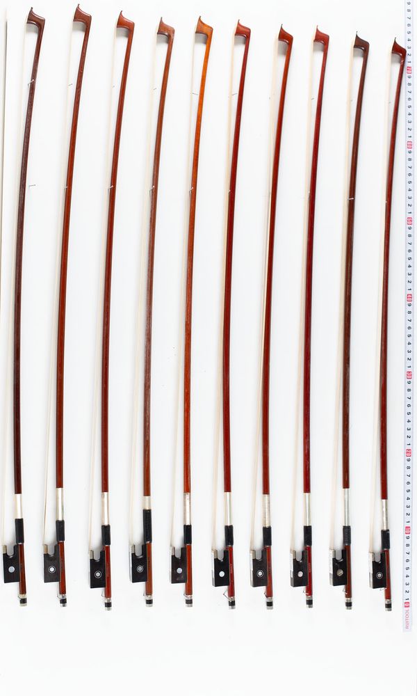 A bundle of ten violin bows, varying sizes