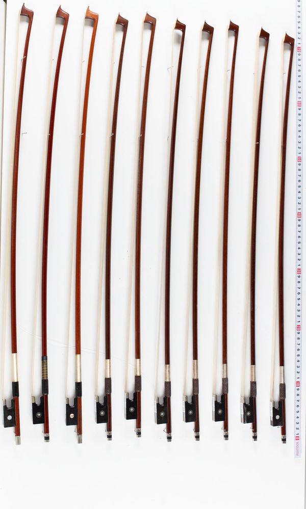 A bundle of ten violin bows, varying sizes