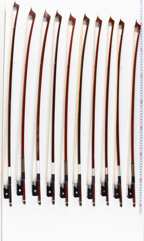 A bundle of ten cello bows, varying sizes