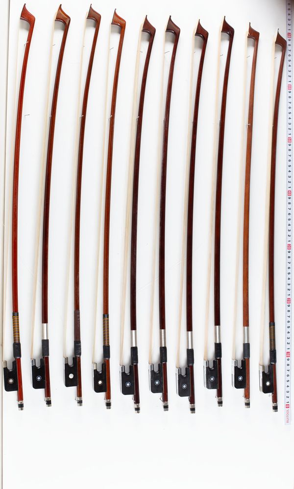 A bundle of ten cello bows, varying sizes