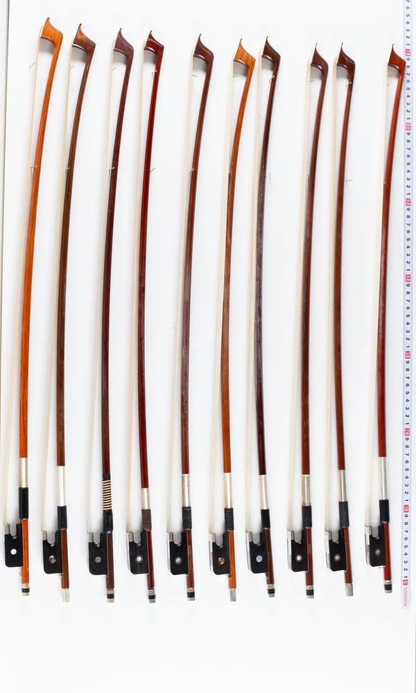 A bundle of twelve cello bows, varying sizes