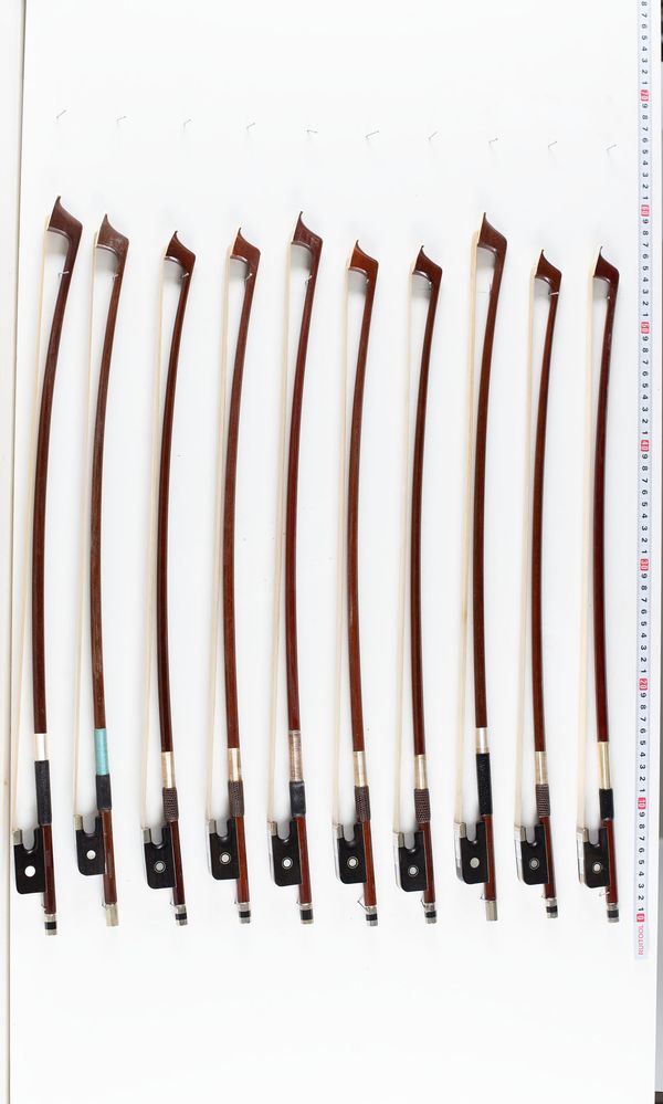 A bundle of ten 1/4 sized cello bows, varying sizes