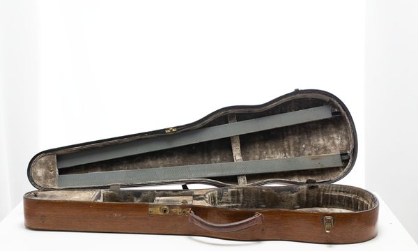 A violin case, branded W. E. Hill & Sons