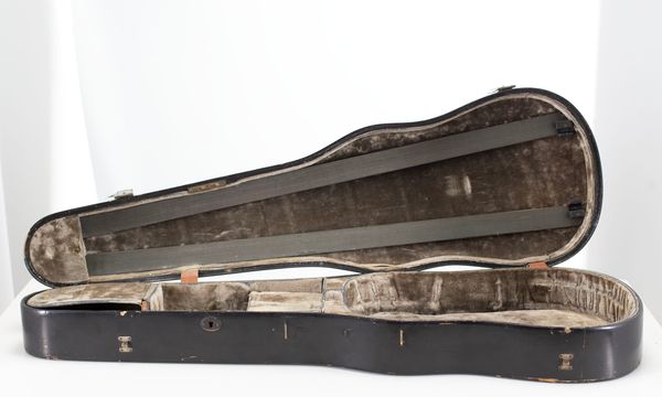 A violin case, branded W. E. Hill & Sons