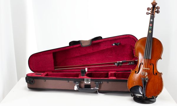 A small-sized violin, labelled The London violin co ltd 25 Nottingham street  W.1