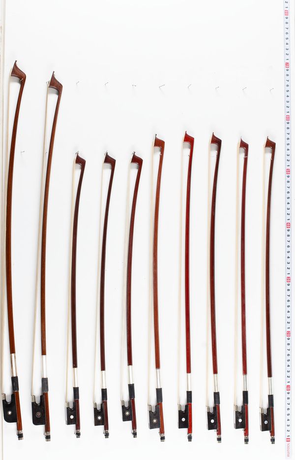 Fourteen child-sized violin bows and five child-sized cello bows, various lengths