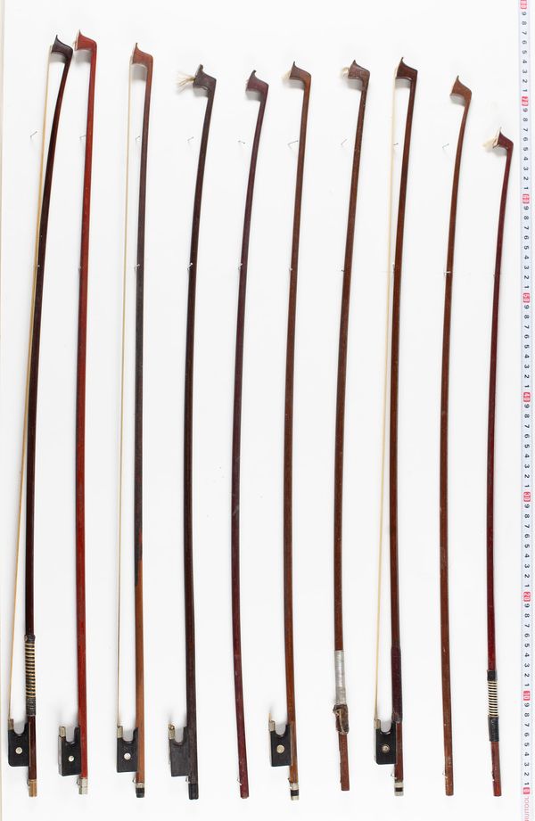 Twelve violin bows and five sticks, various lengths