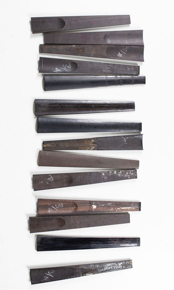 A bundle of fourteen 3/4 sized violin fingerboards