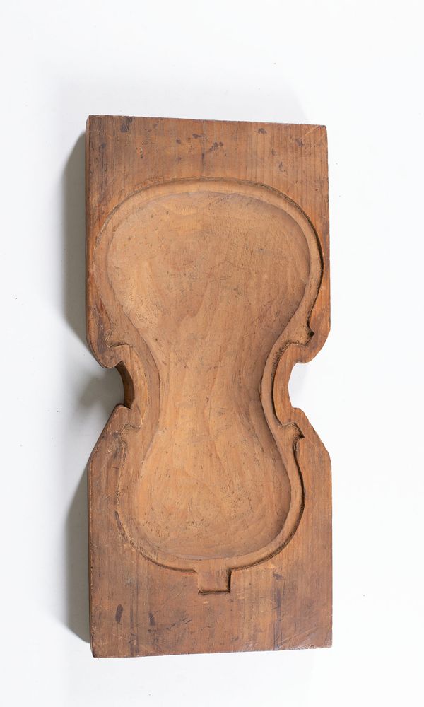 A violin carving cradle