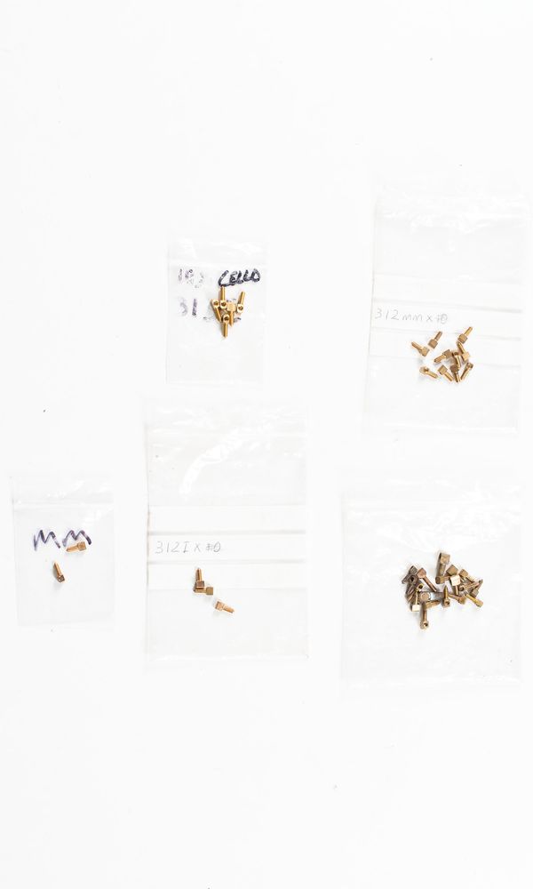 A bundle of bow eyelets, varying sizes