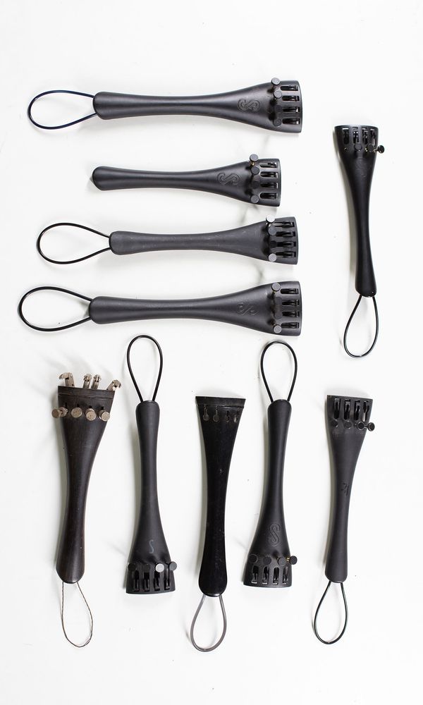 A bundle of fifteen cello tailpieces, varying sizes