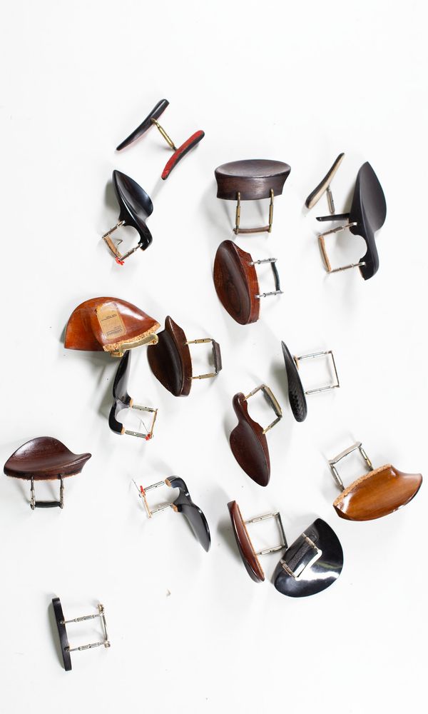 A bundle of ten chinrests, varying sizes