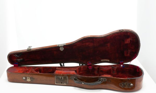 A violin case, branded Edward Withers