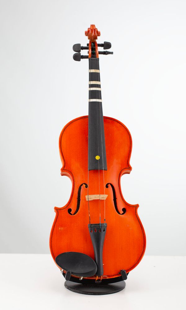 Four half-sized violins, varying sizes