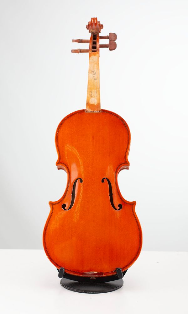 Four half-sized violins, varying sizes