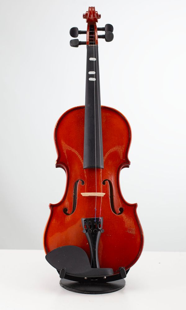 Four half-sized violins, varying sizes