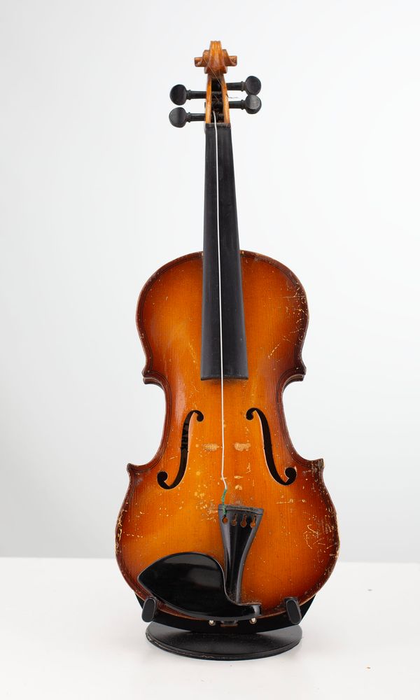 Four quarter-sized violins, varying sizes