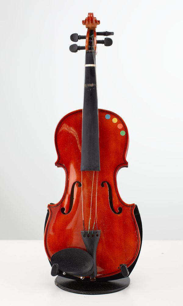 Four one-eighths-sized violins and one one-sixteenth-sized violin, varying sizes