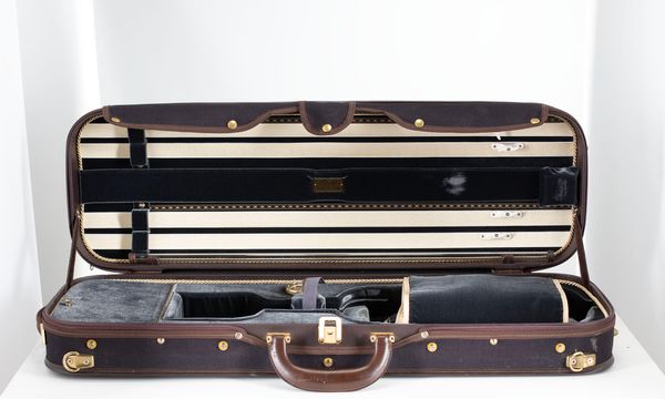 A violin case, branded Musafia