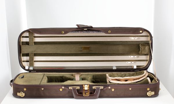 A violin case, branded Musafia