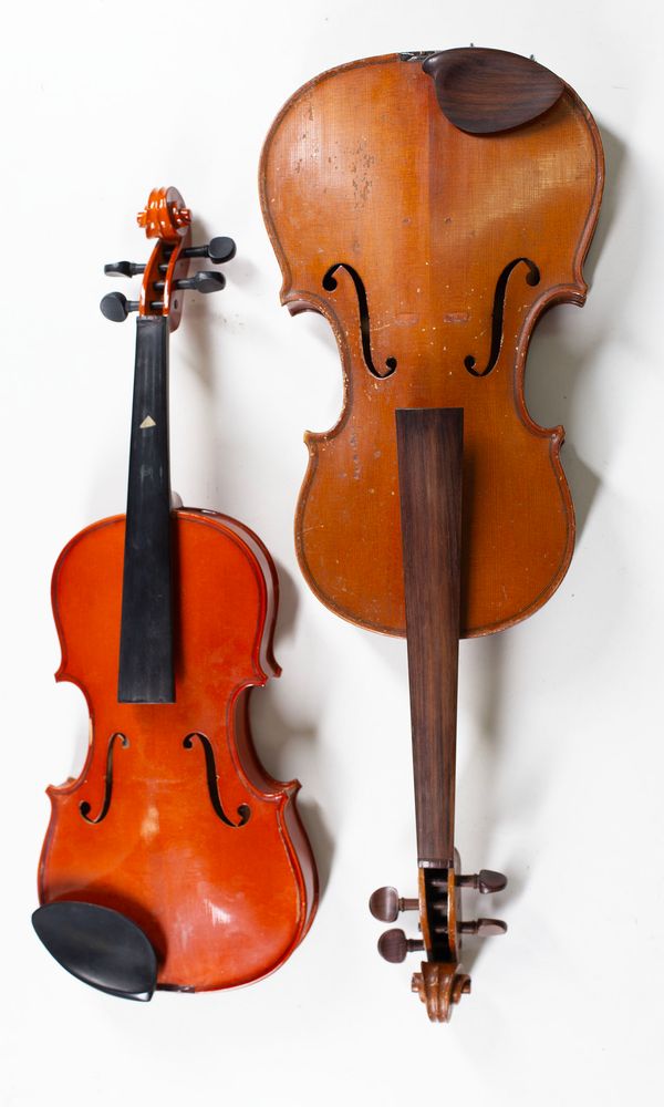 One viola and three violins, varying sizes