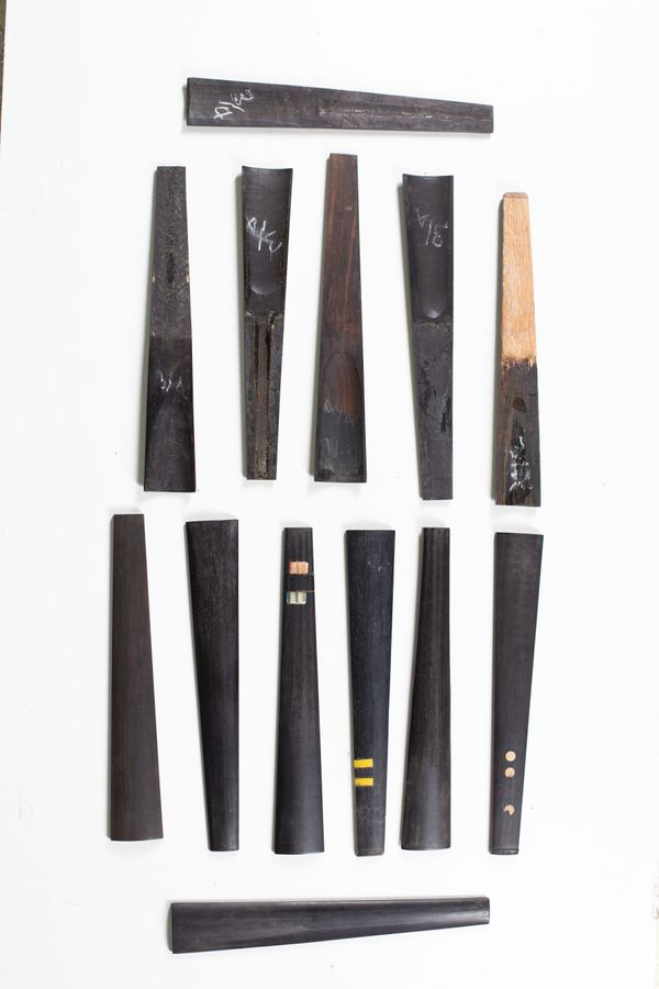 A bundle of thirteen 3/4 sized violin fingerboards