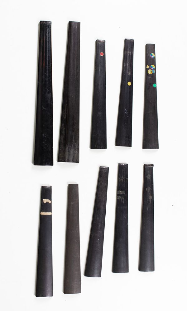 A bundle of eight 1/2 sized violin fingerboards and two viola fingerboards
