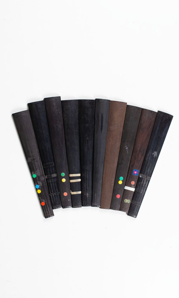 A bundle of ten 1/2 sized violin fingerboards