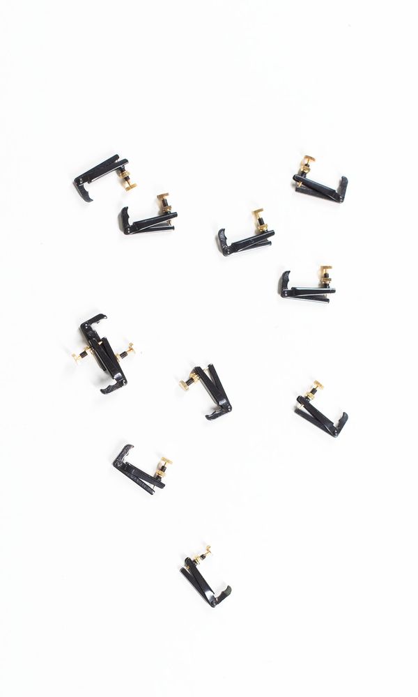 A bundle of eleven viola fine tuners