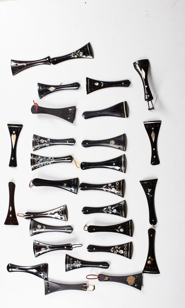 Twenty-eight violin tailpieces